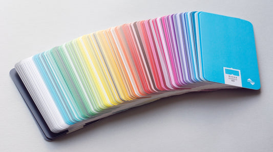 a stack of colorful notebooks sitting on top of a table